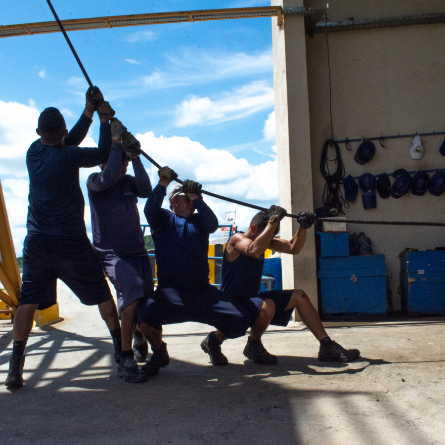 Workers Raise Gem-Ore in Unison